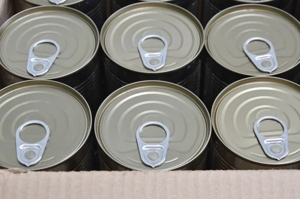 Tin can in paper box
