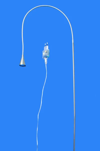 Modern floor lamp  with socket and cable on blue background