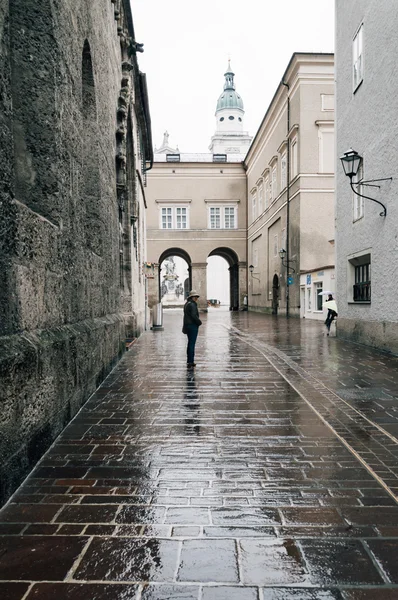 Woman walking on the rain in Salzburg
