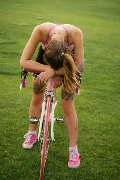 Active woman tired from riding a bicycle