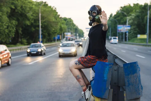 Ecological concept of air contamination. Woman in gas mask