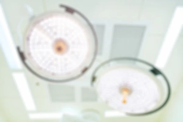 Blur of two surgical lamps in operation room