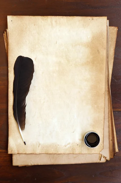 Old paper with feather and ink