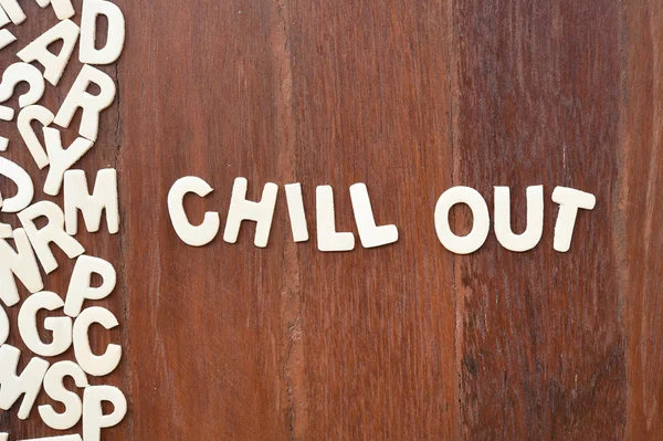 Word chill out made with block wooden letters