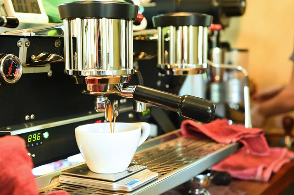 Coffee machine preparing cup of coffee