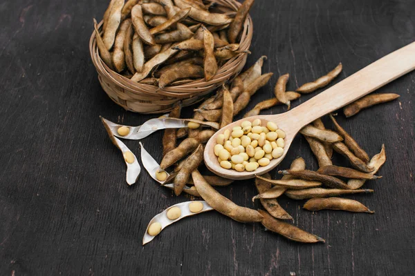 Soybeans pod, harvest of soy beans background Soybeans on a wooden background. rustic style