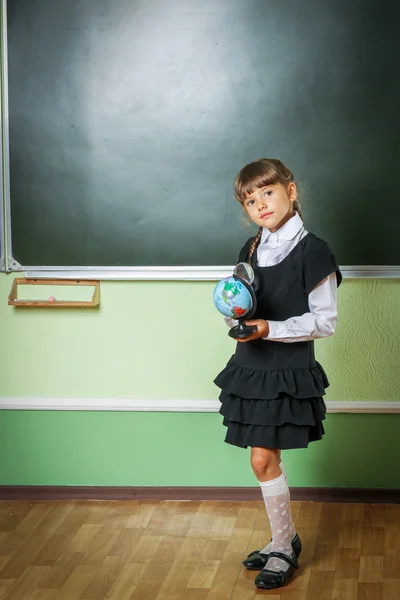School, girl, schoolgirl 6 years in a black dress and a white sh