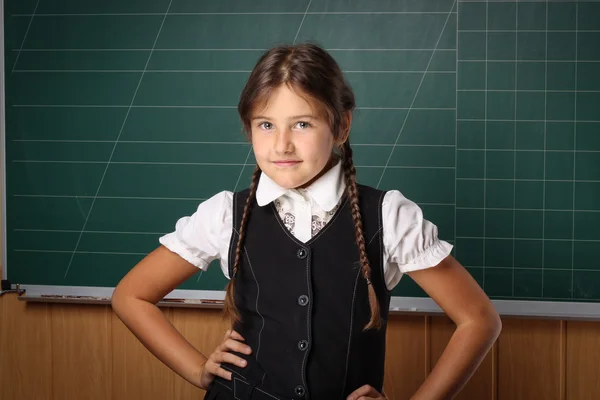 Girl schoolgirl in a black school uniform, a white shirt with tw