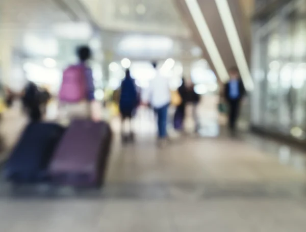 Traveling People with Baggage walking in train station Blur background
