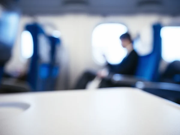Blur Businessman Passenger sit in train Window seat Blur background