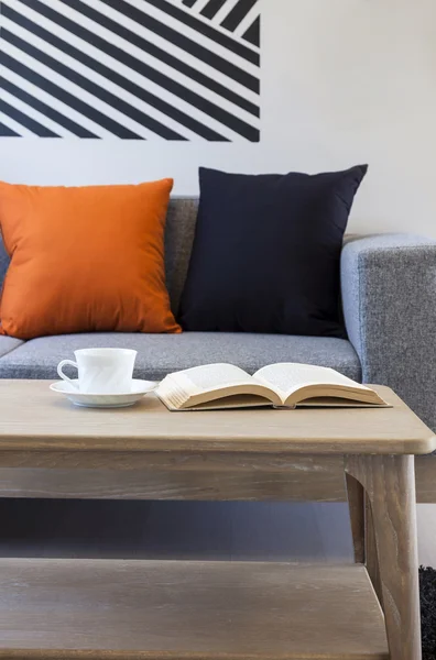 Living room sofa with coffee book on  wooden table