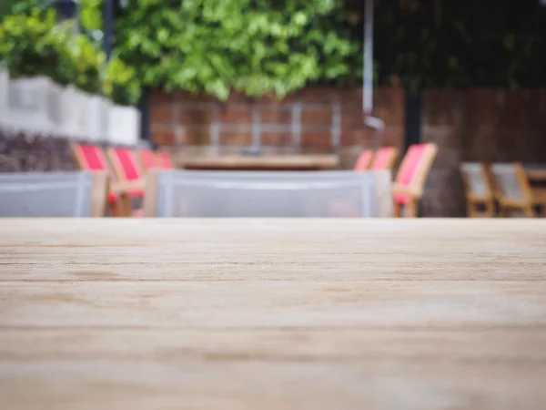 Top of Wooden table with Blurred restaurant cafe Background