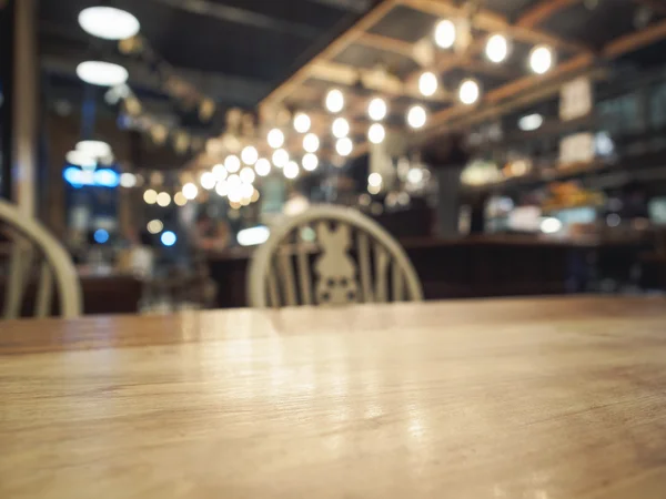 Top of wooden table with Blurred Bar restaurant background