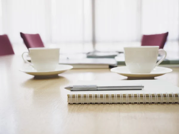 Table with coffee and book in Boardroom meeting Business concept