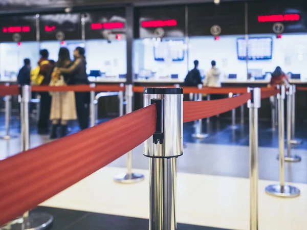 People buy ticket at Ticket Booth in Train Station