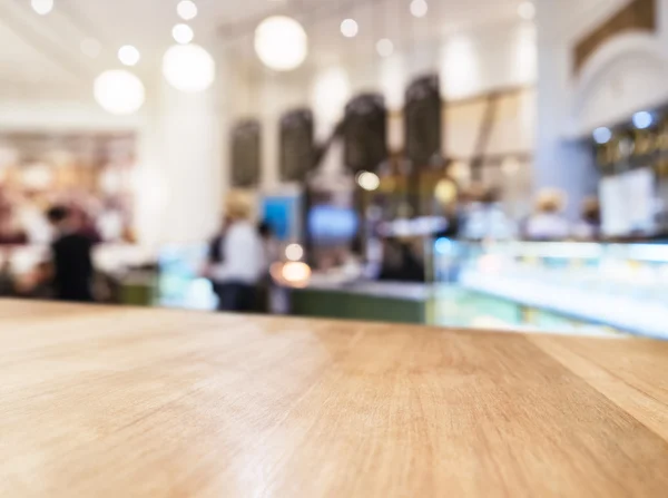 Table top Counter with Blurred People and Restaurant Shop
