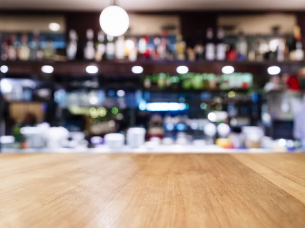 Table top with Blurred Bar restaurant cafe interior background