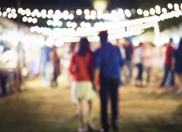 Couple in Love walking in Festival Event Party background