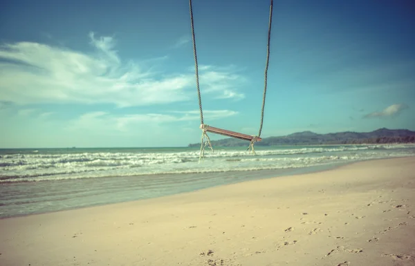 The swing against the sea waves