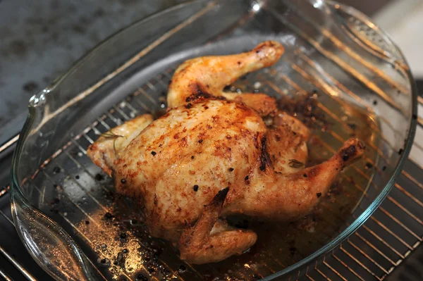 Whole chicken in a glass dish