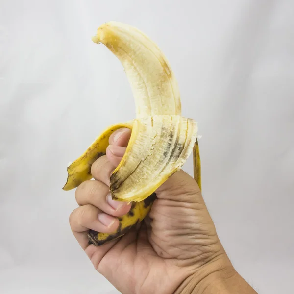 Old banana catch hand on white background