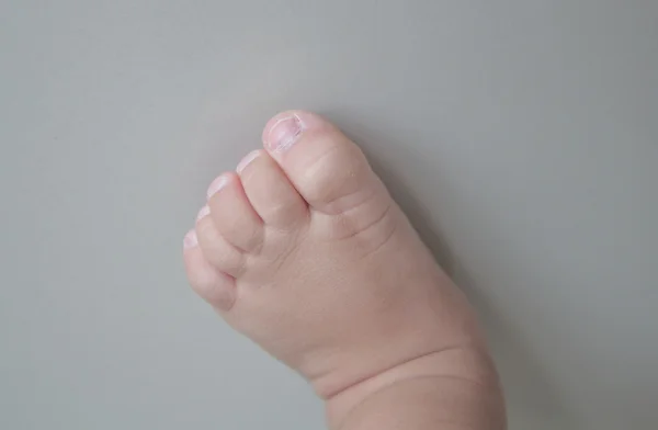 Foot of a little feet, isolated on a white background