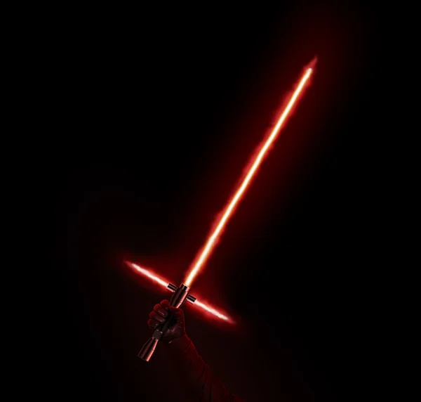 New red light saber holdng in hand isolated on black.