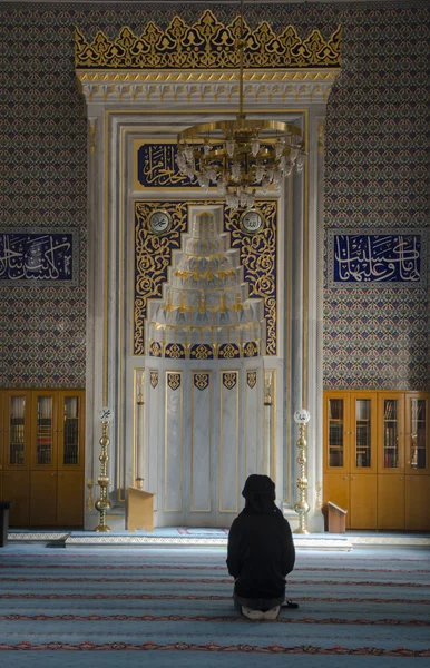 Young Muslim Woman Praying In Mosque