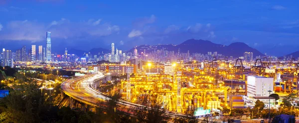 Panorama of cargo terminal and Hong Kong cityscape
