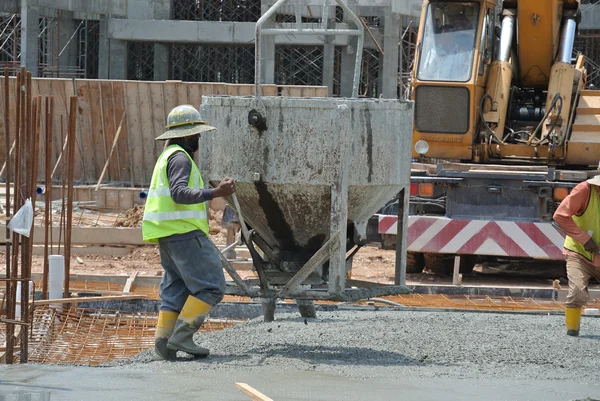 Group of construction workers casting for ground floor slab