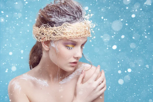 Winter beauty young woman portrait,model creative image with frozen makeup, with porcelain skin and long white lashes showing trendy, Ice-queen, Snow Queen, studio