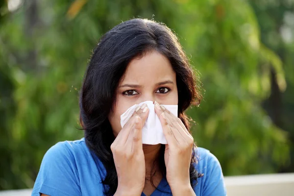 Young woman suffering with cold