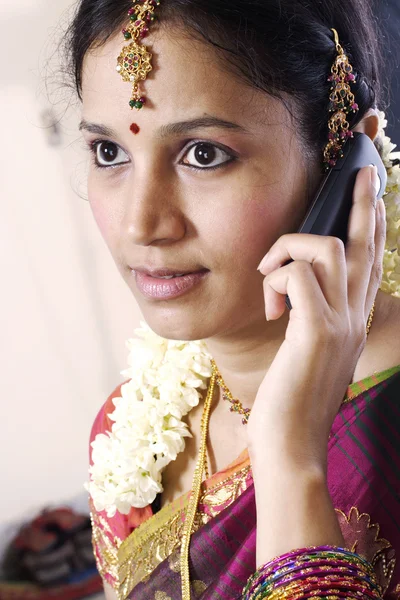 Traditional Indian woman talking on a cellphone