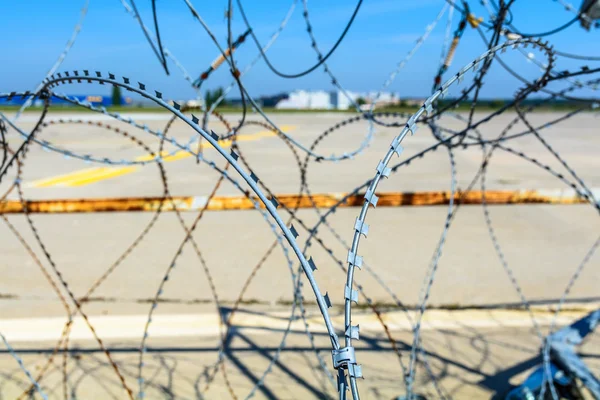 Close-up of a barbed wire fence. Horizontal view of a barbed wir