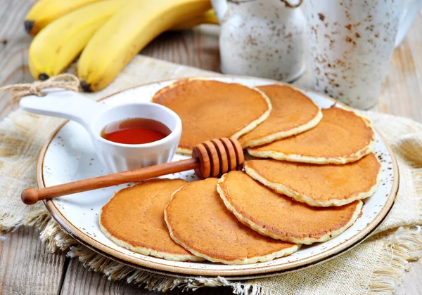 Vegetarian Pancake without eggs with organic agave syrup and bananas