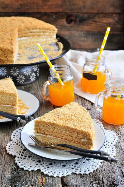 Homemade honey cake on a wooden table. Rustic style.