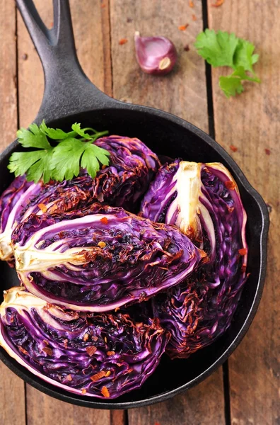 Red cabbage baked in olive oil with chili pepper flakes and sea salt. vegetarian food. image is tinted