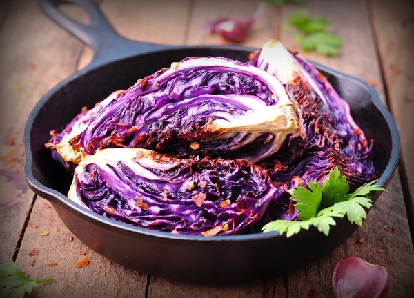 Red cabbage baked in olive oil with chili pepper flakes and sea salt. vegetarian food. image is tinted