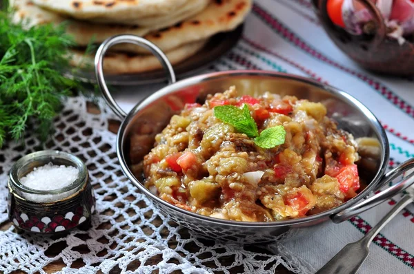 Eggplant caviar (salad) with tomato, white onion, olive oil and sea salt with lavash bread