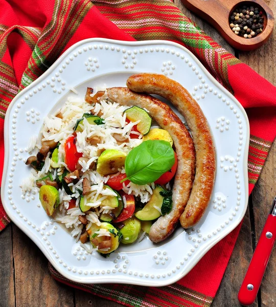 Fried rice with Brussels sprouts, mushrooms, zucchini, garlic, cherry tomatoes, basil, parsley and chicken sausages