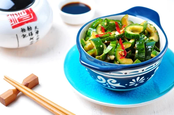 Chinese cucumber salad with chilli pepper, garlic, soy sauce and sesame oil.