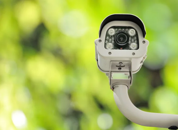 Front view of surveillance camera against nature background