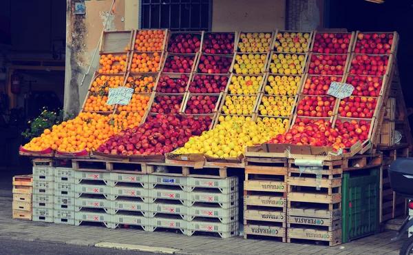 Street fruit and vegetables market place in Italy. Fresh food storage, store, market. Lemons, apples, oranges in the food fruits market stall.