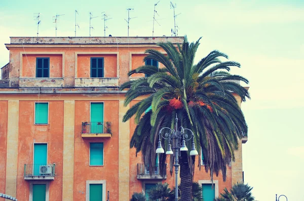 Beautiful view italy terrachina street. Italy street view, building construction, hous with palm tree. Beautiful building, colorful house in town city street in Italy, street with house.