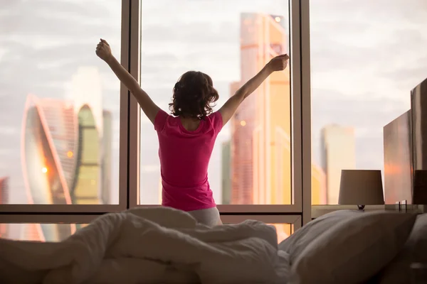 Woman relaxing in the morning in bed