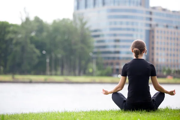 Young office woman sitting in yoga pose