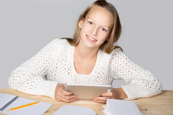 Girl reading with tablet