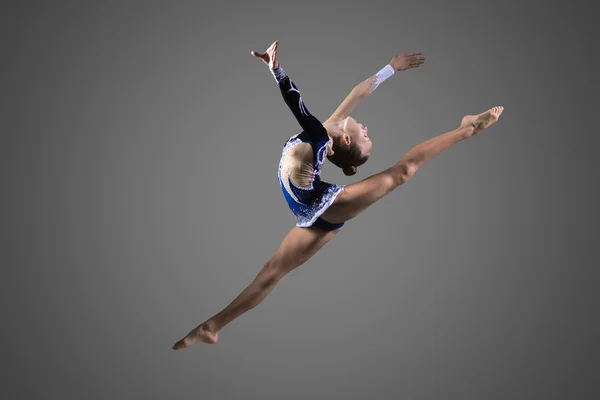 Gymnast girl doing splits in the air