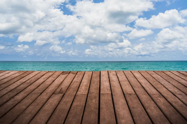 Perspective empty wooden terrace with sea and sky background