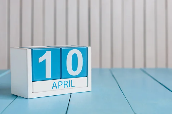 April 10th. Image of april 10 wooden color calendar on white background.  Spring day, empty space for text. International Day Of resistance movement